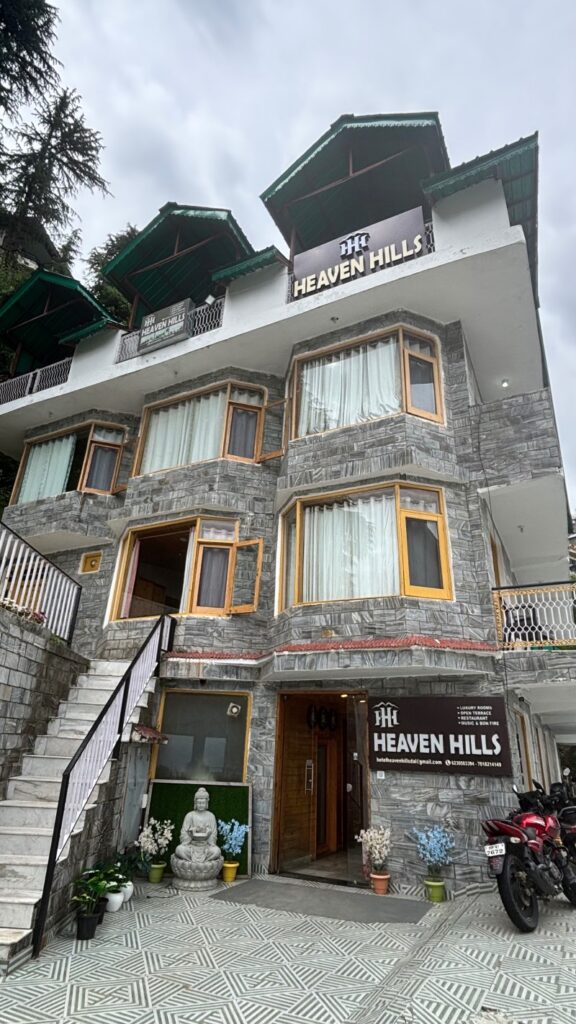 Heaven Hills hotel exterior in Dalhousie with stone facade and green-roofed balconies